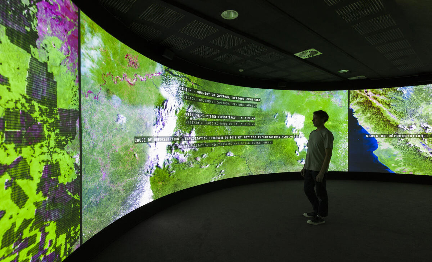 ​​​​​​Installation view of a curved screen displaying data