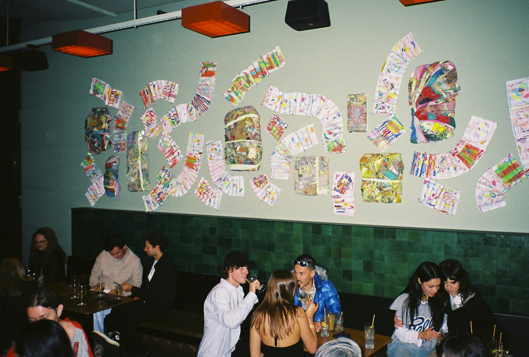 installation view of artwork on top of bar bench