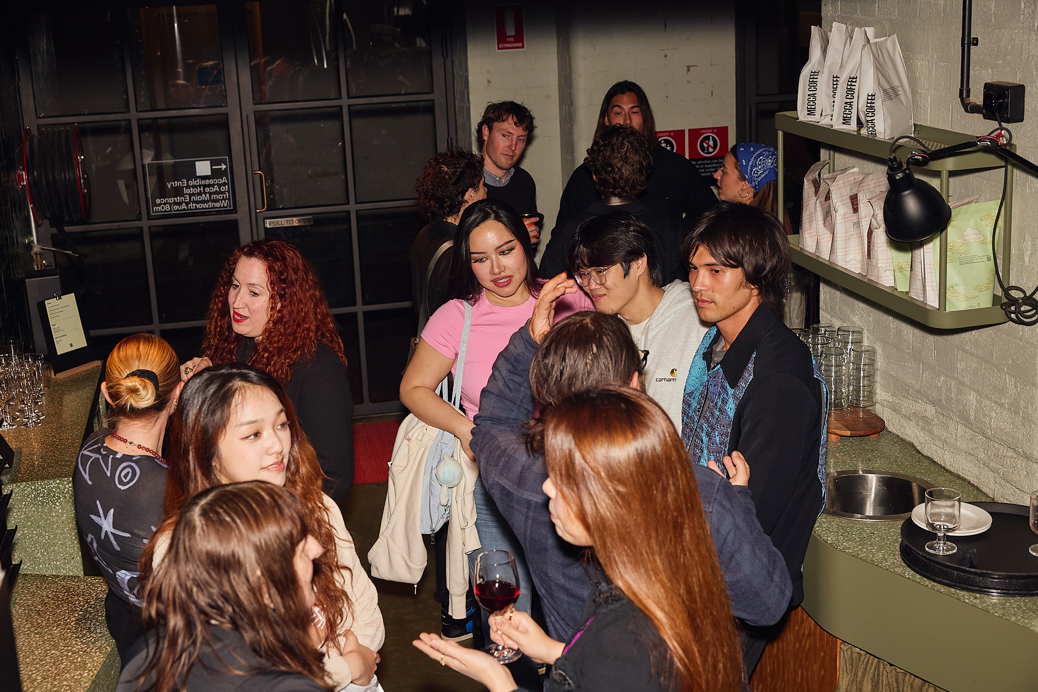 Remy Faint and people talking in Ace Hotel