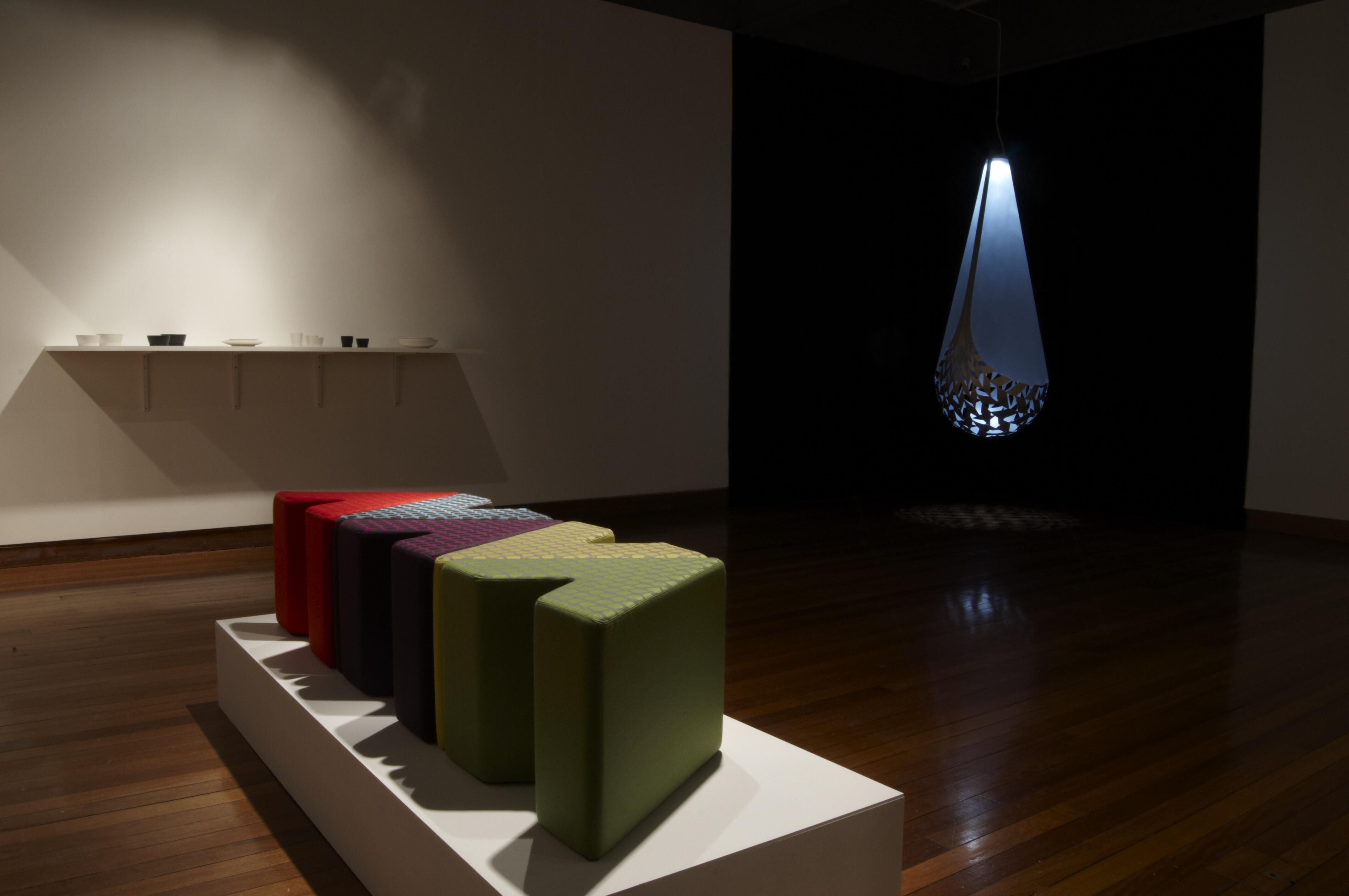 Exhibition space featuring various sculptural objects