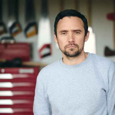 Portrait of artist James Tylor in his workshop