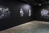 Installation view of four artworks mounted onto a wall