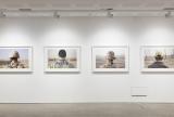 Installation view of four photographs 