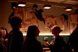 People talking in Ace Hotel in front of artwork